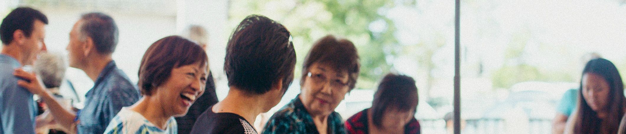 Church members laughing and talking together during fellowship